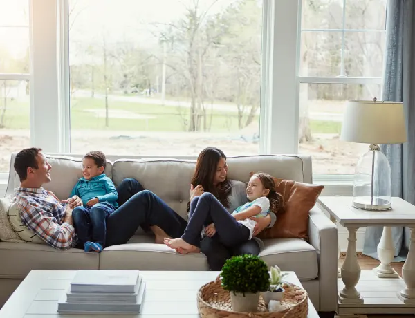 Family together on their couch